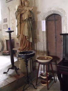 Votive stand and pebble pool